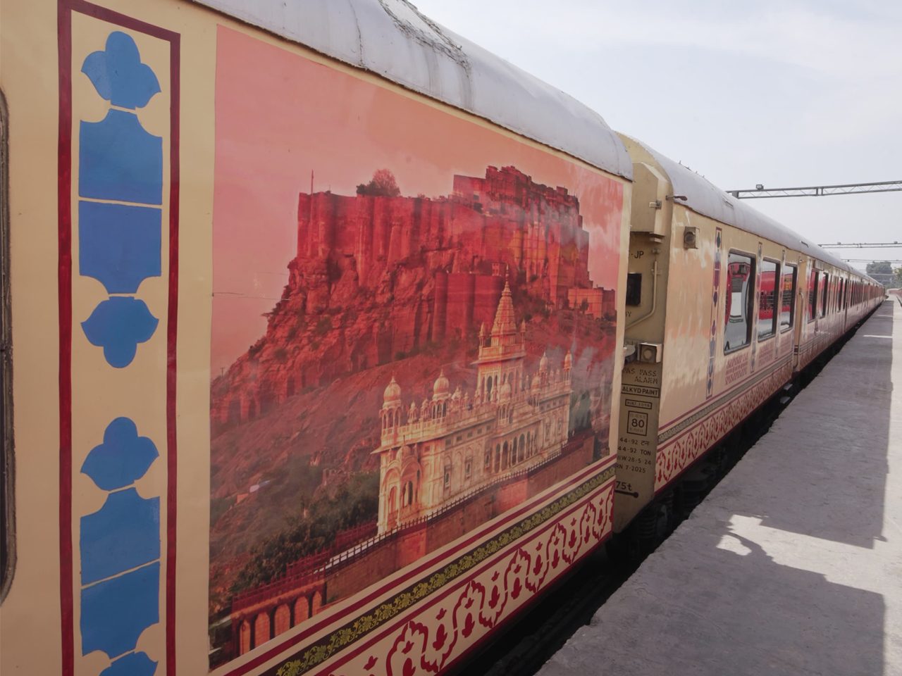 The Palace on Wheels luxury train with its hand-painted heritage livery at a Rajasthan railway platform