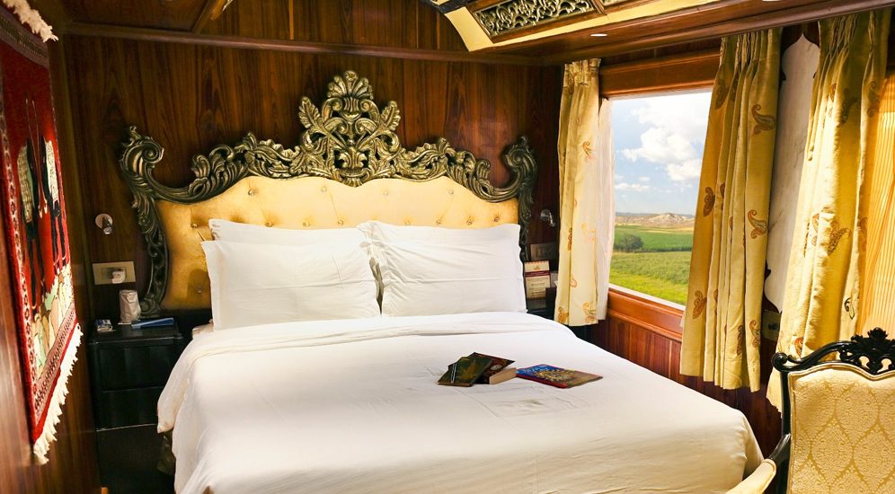 The Presidential Suite aboard the Palace on Wheels with hand-carved Thikri ceiling